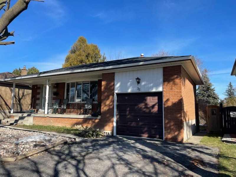 Brick bungalow with new white eavestroughs installed in Scarborough