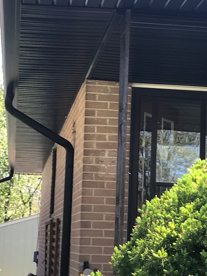 Close-up of professional eavestrough and downspout installation
